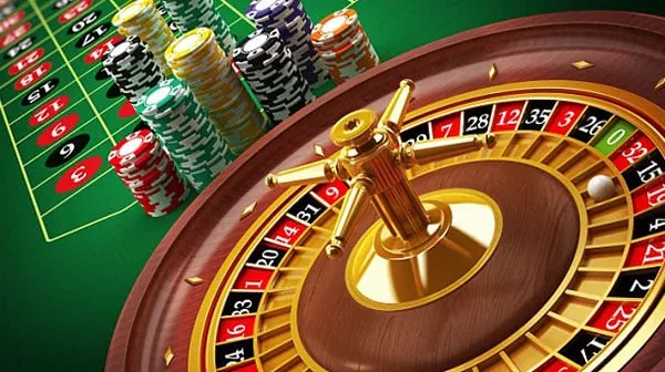 Live casino dealer dealing cards at a blackjack table
